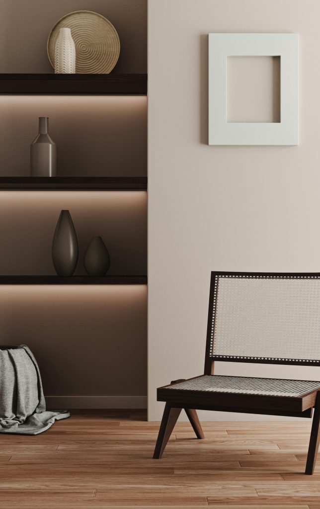 Armchair in front of a bookshelf in a calm reading corner